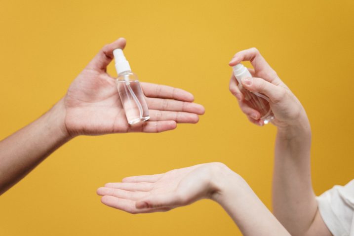 People handling bottles of cosmetics to prepare for their city break